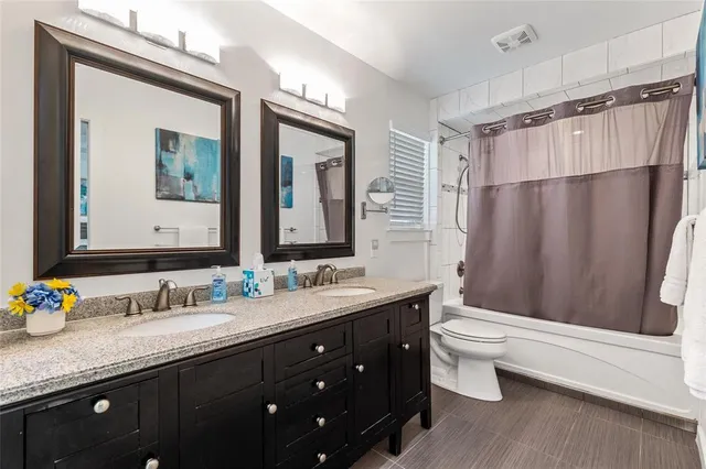 a bed room with a bed and a painting