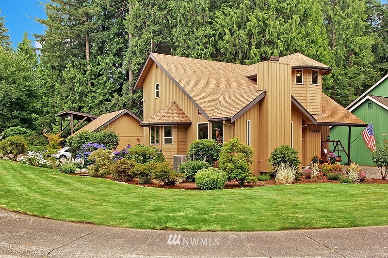 19908 4th Avenue Southeast Bothell, WA 98012 - Photo 2 of 21 a front view of a house with a garden