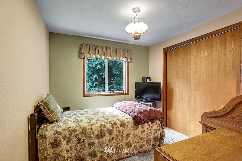 19908 4th Avenue Southeast Bothell, WA 98012 - Photo 11 of 21 a bedroom with a bed and window