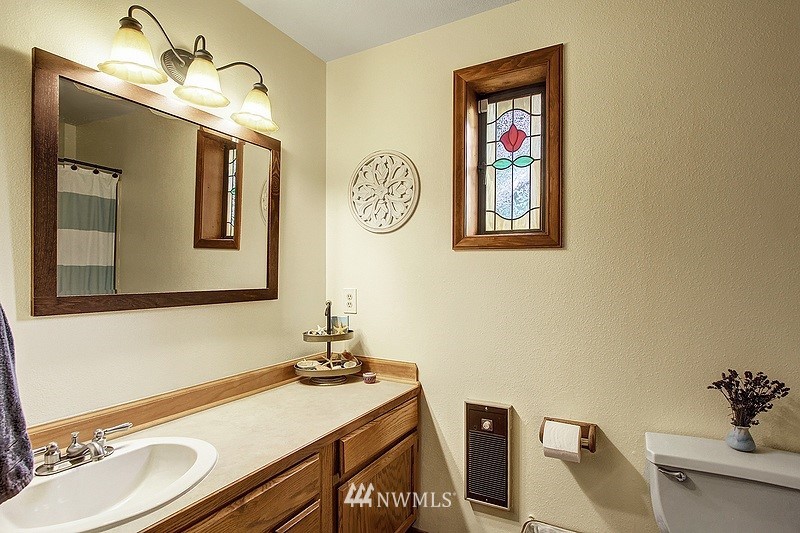 19908 4th Avenue Southeast Bothell, WA 98012 - Photo 12 of 21 a bathroom with a sink and a mirror