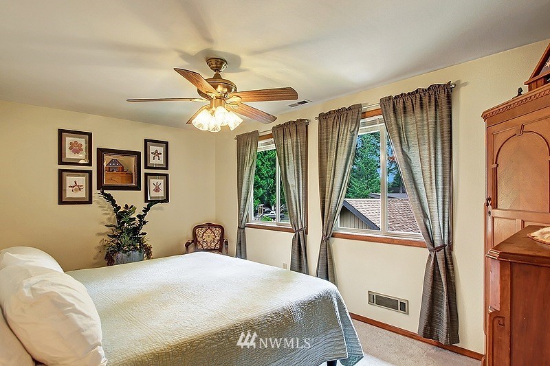 19908 4th Avenue Southeast Bothell, WA 98012 - Photo 14 of 21 a bedroom with a bed and a large window with the outer view