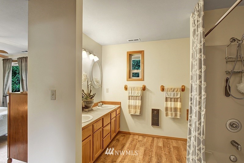 19908 4th Avenue Southeast Bothell, WA 98012 - Photo 15 of 21 a bathroom with a tub sink and mirror
