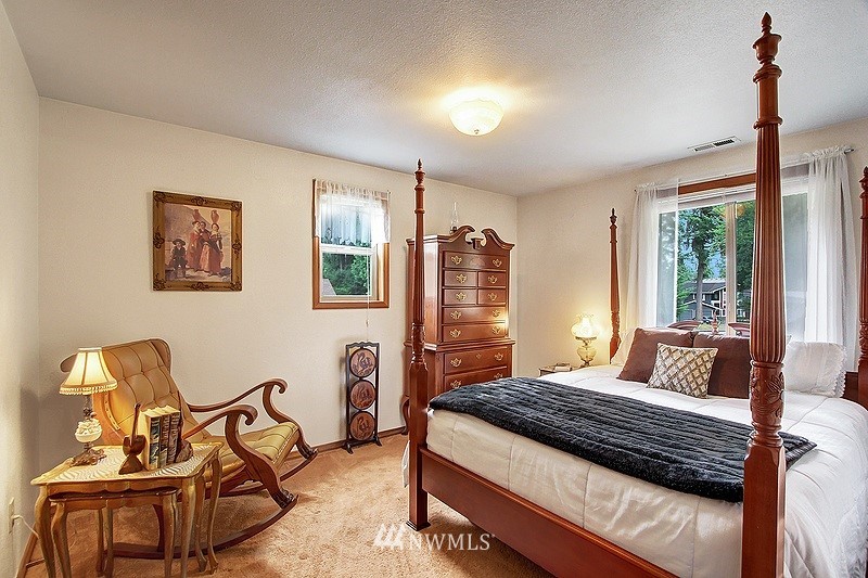 19908 4th Avenue Southeast Bothell, WA 98012 - Photo 16 of 21 a bedroom with a bed a chair and couch