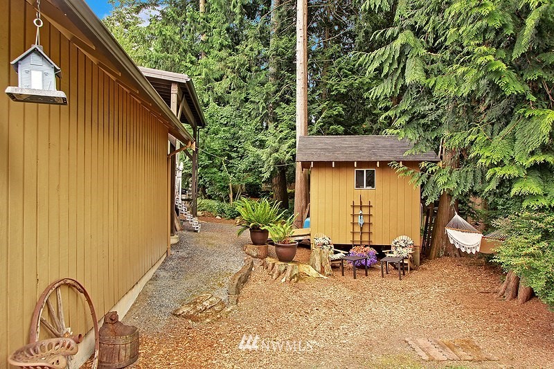 19908 4th Avenue Southeast Bothell, WA 98012 - Photo 18 of 21 a view of a backyard with table and chairs and potted plants