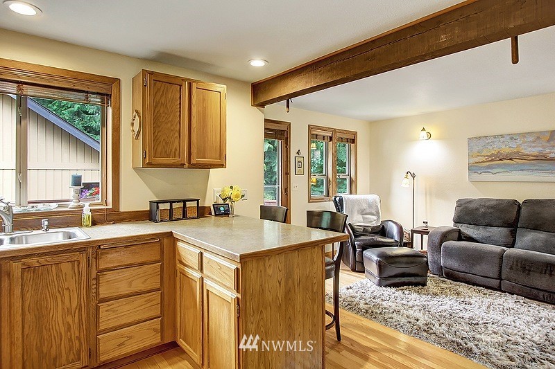 19908 4th Avenue Southeast Bothell, WA 98012 - Photo 6 of 21 a living room with furniture and a kitchen island