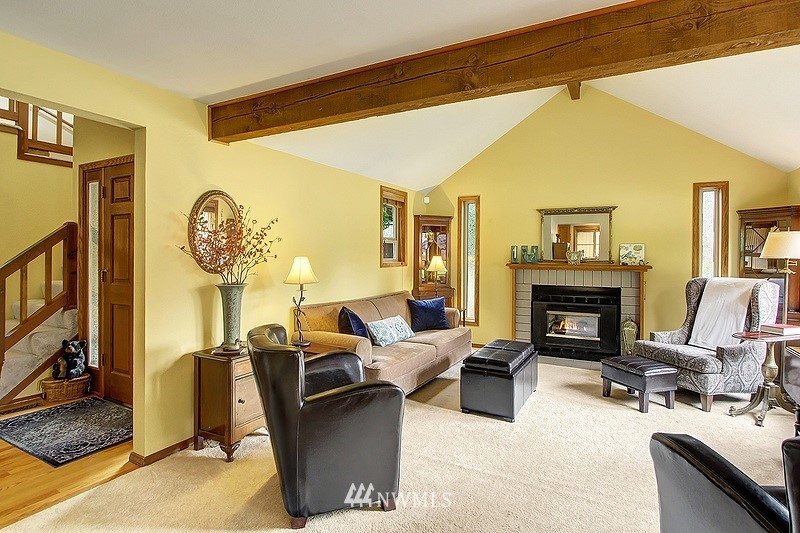 19908 4th Avenue Southeast Bothell, WA 98012 - Photo 8 of 21 a living room with furniture a fireplace and a flat screen tv