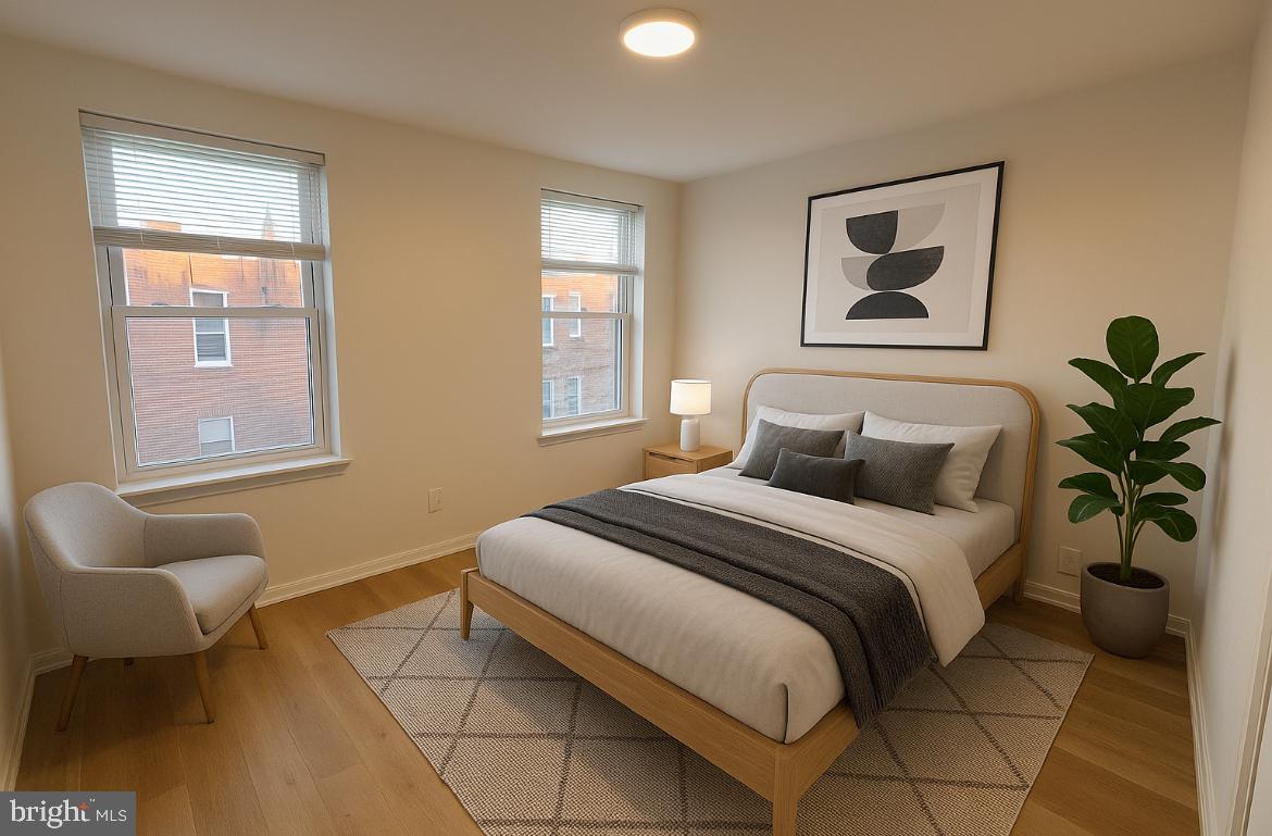 3252 Hope Street Philadelphia, PA 19140 - Photo 18 of 19 a bedroom with a bed and painting on the wall