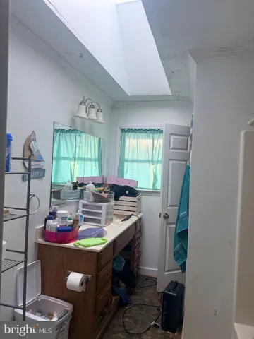 a kitchen with kitchen island a sink stove and cabinets