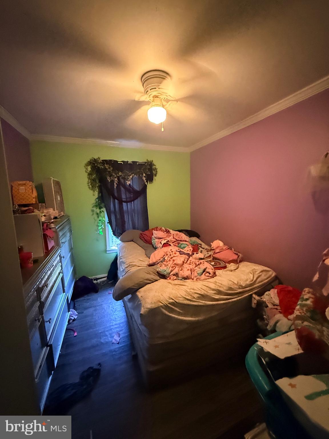 121 Elizabeth Street Culpeper, VA 22701 - Photo 7 of 22 a bed sitting in a room next to a lamp