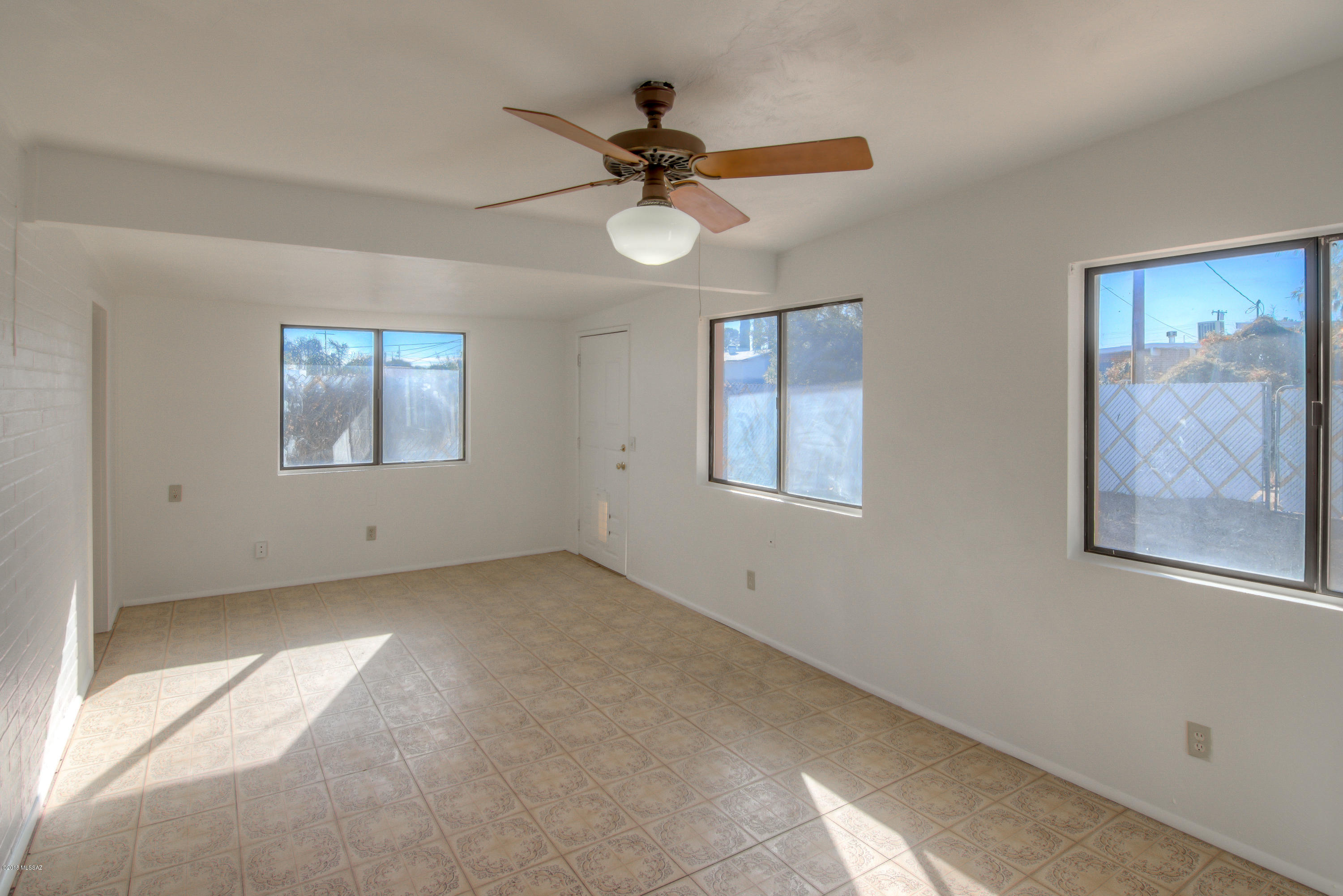 1841 West Astolat Road Tucson, AZ 85713 - Photo 7 of 40 a view of an empty room with a window