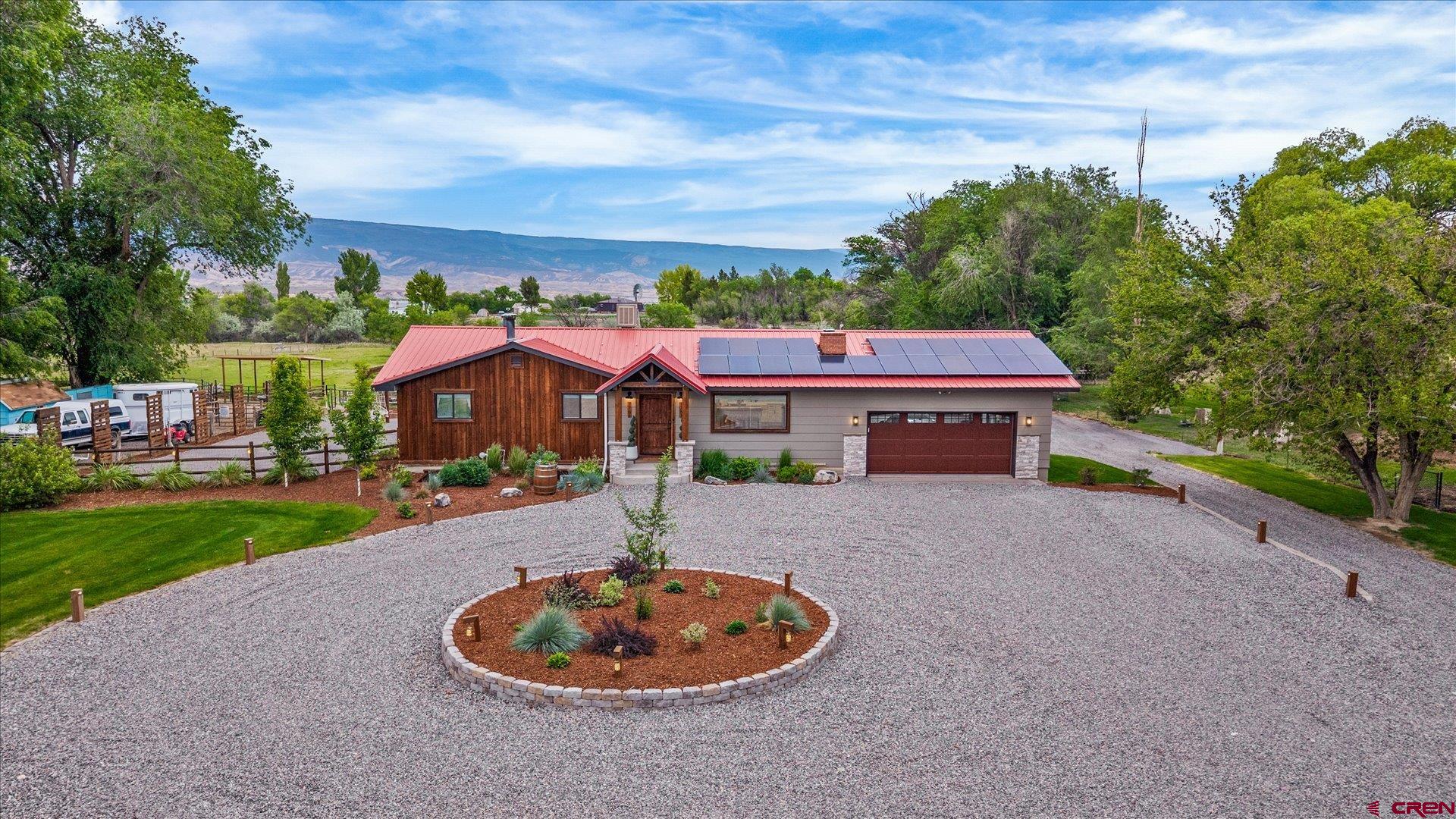 1761 G Road Delta, CO 81416 - Photo 31 of 43 a front view of a house with a garden