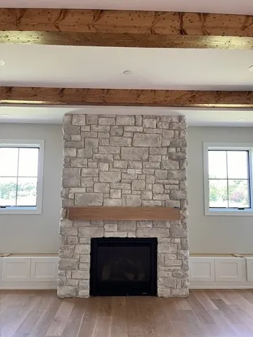 a living room with a fireplace and a flat screen tv