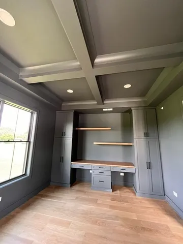 a view of a room with window and cabinet