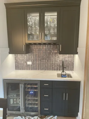 a kitchen with a sink and cabinets