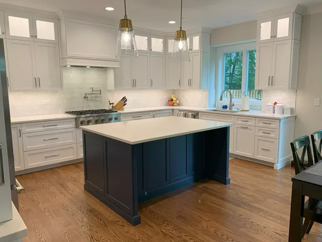 a kitchen with a stove a sink and a refrigerator