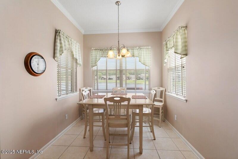 1330 Castle Pines Circle St. Augustine, FL 32092 - Photo 13 of 57 a view of a dining room with furniture window and outside view