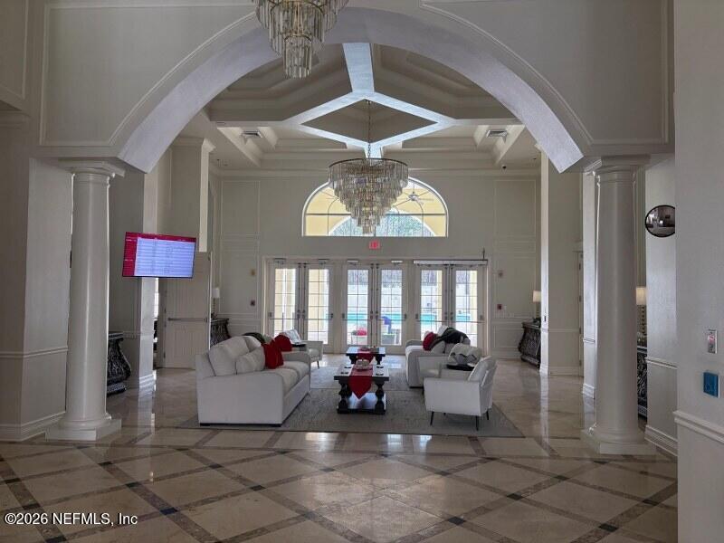 1330 Castle Pines Circle St. Augustine, FL 32092 - Photo 28 of 57 a living room with fireplace furniture and a chandelier