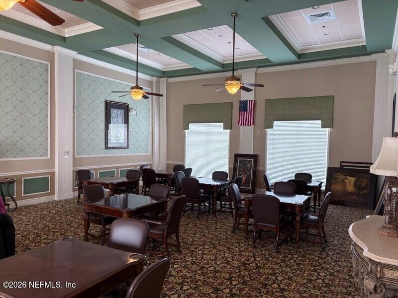 1330 Castle Pines Circle St. Augustine, FL 32092 - Photo 35 of 57 a dining room with furniture and a chandelier