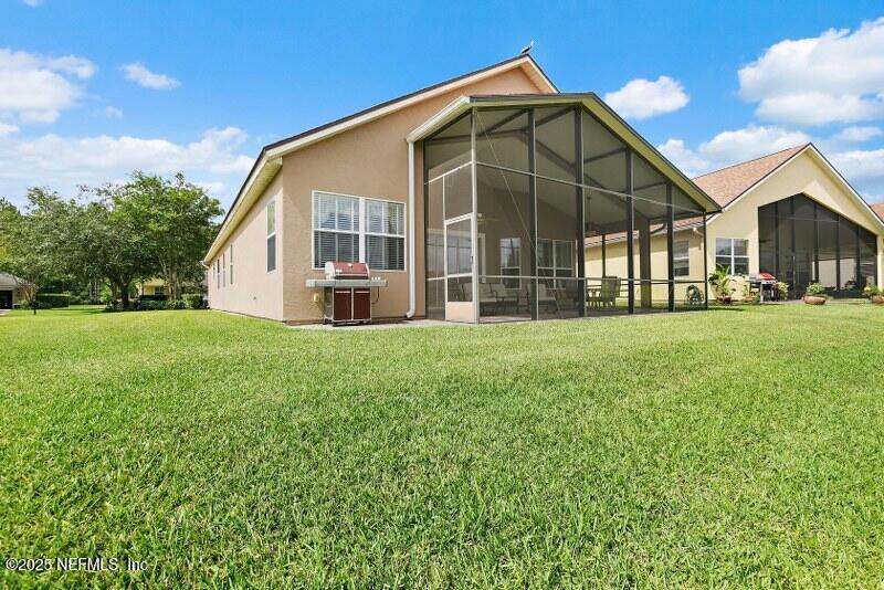 1330 Castle Pines Circle St. Augustine, FL 32092 - Photo 4 of 57 a front view of a house with a yard