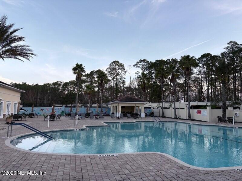1330 Castle Pines Circle St. Augustine, FL 32092 - Photo 44 of 57 a view of a swimming pool with a sitting space