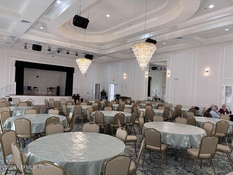 1330 Castle Pines Circle St. Augustine, FL 32092 - Photo 57 of 57 a living room with lots of white furniture and a chandelier