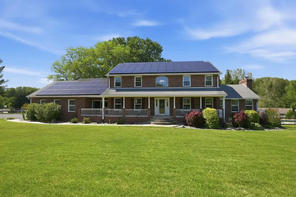 front view of a house with a yard
