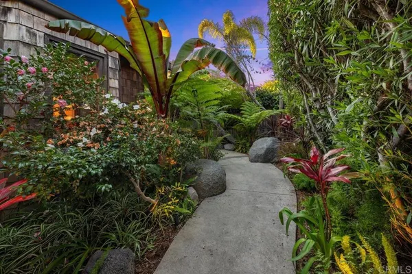 a kitchen with stainless steel appliances granite countertop a refrigerator sink and microwave