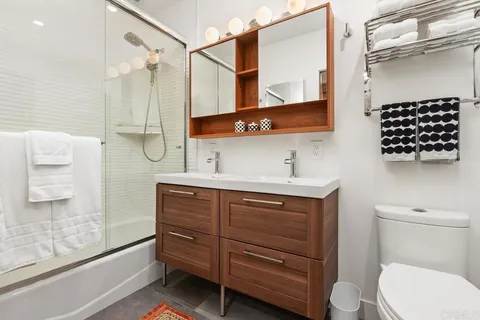 a bathroom with a bathtub and a shower