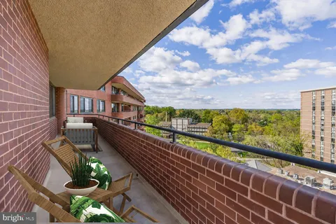 a view of balcony with furniture