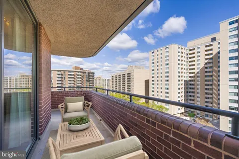 a view of balcony with furniture