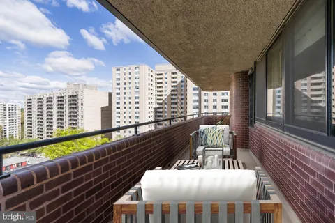 a balcony of a city view with wooden floor