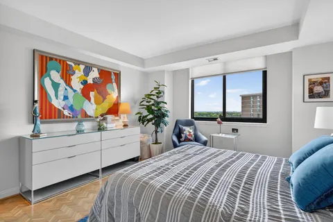 a bedroom with a bed and window