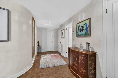 a bedroom with a bed and a mirror
