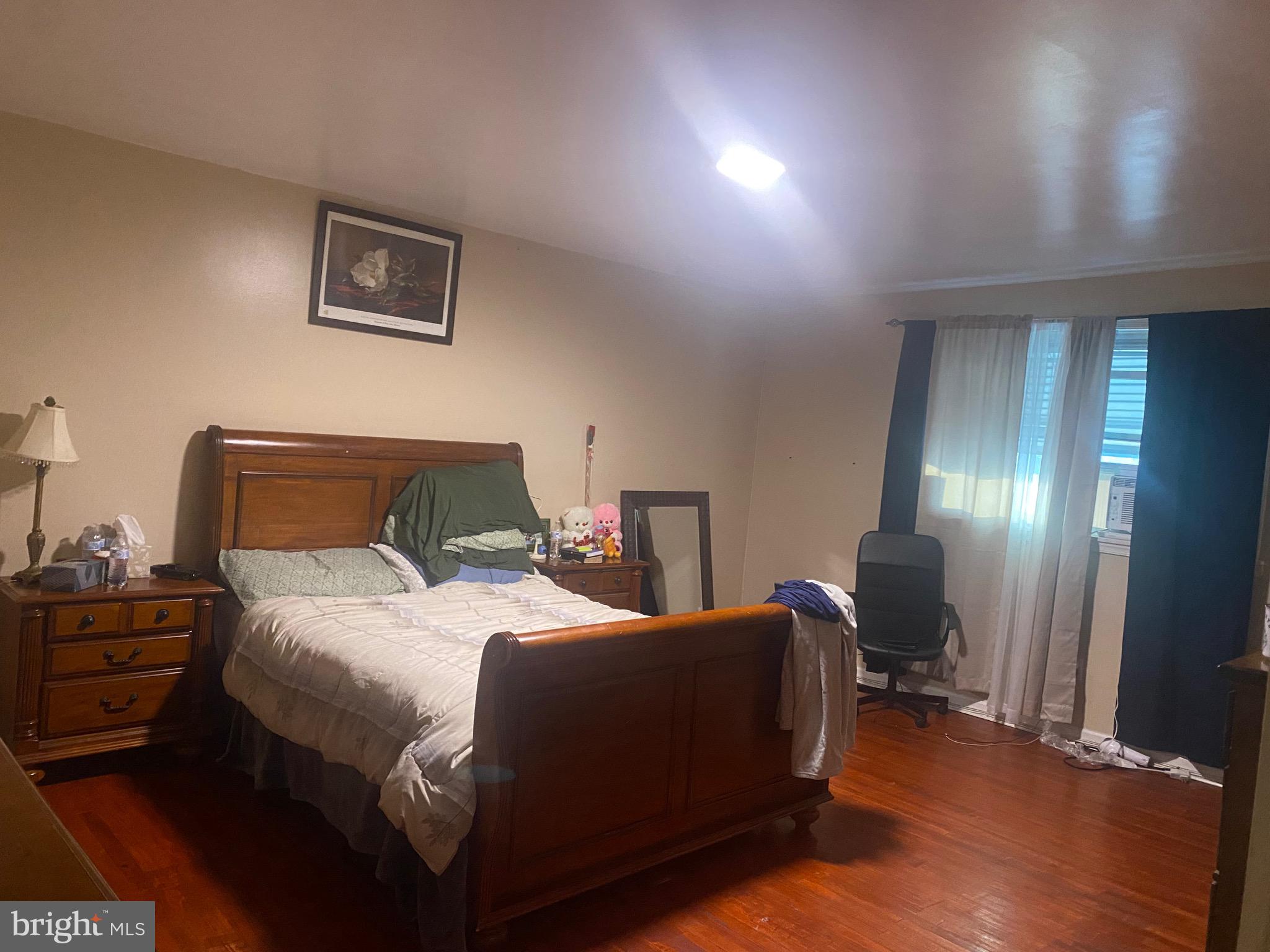 2839 Tremont Street Philadelphia, PA 19136 - Photo 12 of 14 a bedroom with a bed and a mirror