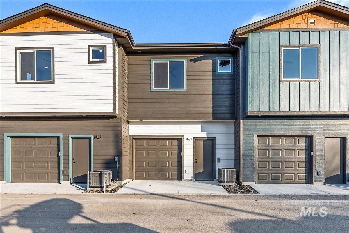 1433 North Bluffs Ridge Lane Boise, ID 83704 - Photo 18 of 18 Craftsman-style home with a garage and board and batten siding