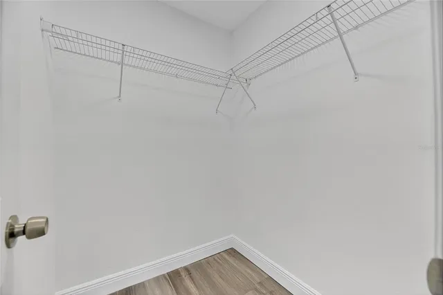 a view of a storage & utility room with kitchen