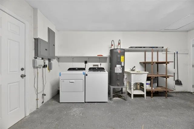 an aerial view of a house with a lake view