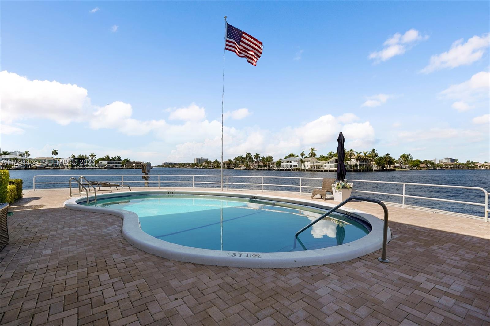 1201 South Riverside Drive, Unit 301 Pompano Beach, FL 33062 - Photo 17 of 24 Relax by the waterfront pool.