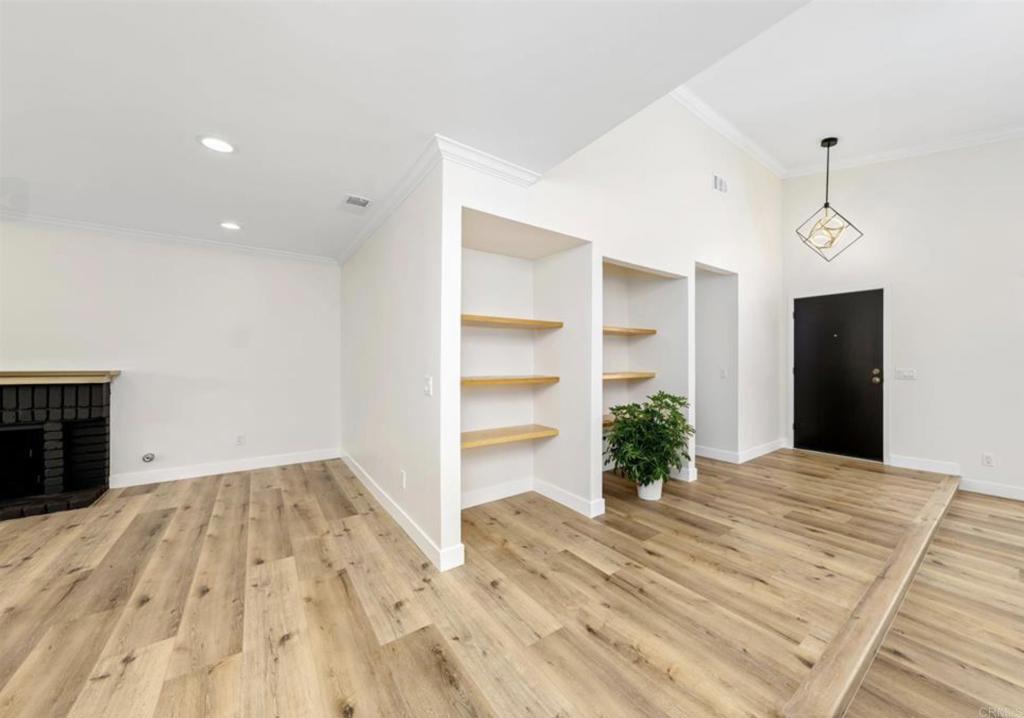 748 Cholla Road Chula Vista, CA 91910 - Photo 11 of 20 a view of empty room with wooden floor and window