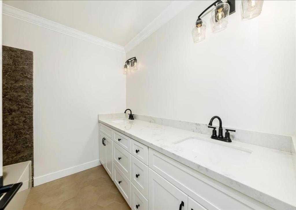 748 Cholla Road Chula Vista, CA 91910 - Photo 12 of 20 a bathroom with a sink and vanity