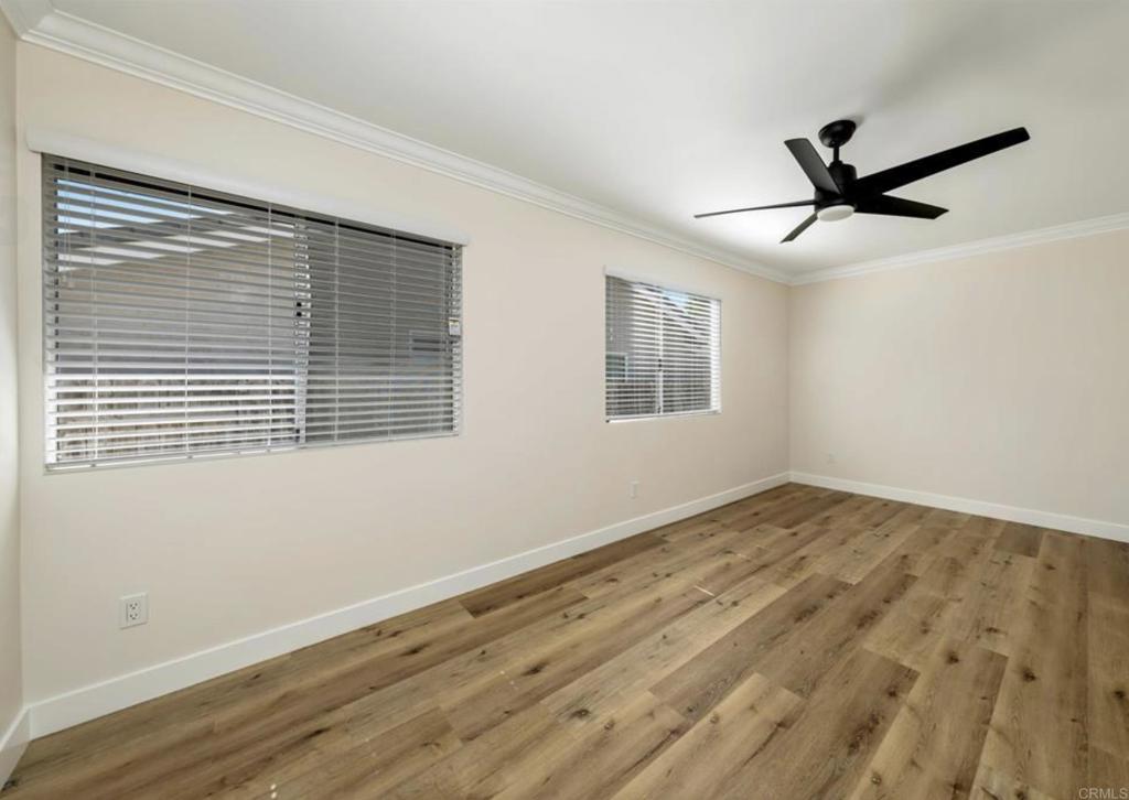 748 Cholla Road Chula Vista, CA 91910 - Photo 13 of 20 a view of empty room with wooden floor and fan