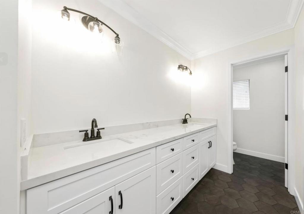 748 Cholla Road Chula Vista, CA 91910 - Photo 16 of 20 a bathroom with a double vanity sink and mirror
