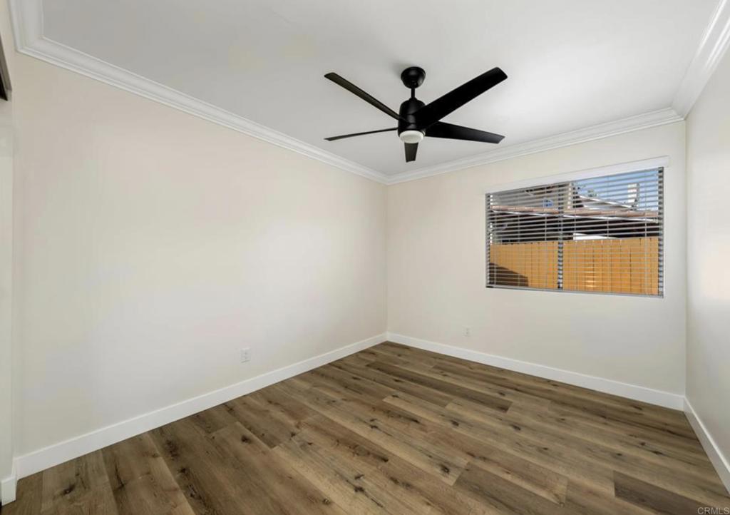 748 Cholla Road Chula Vista, CA 91910 - Photo 18 of 20 a view of a big room with wooden floor closet and windows