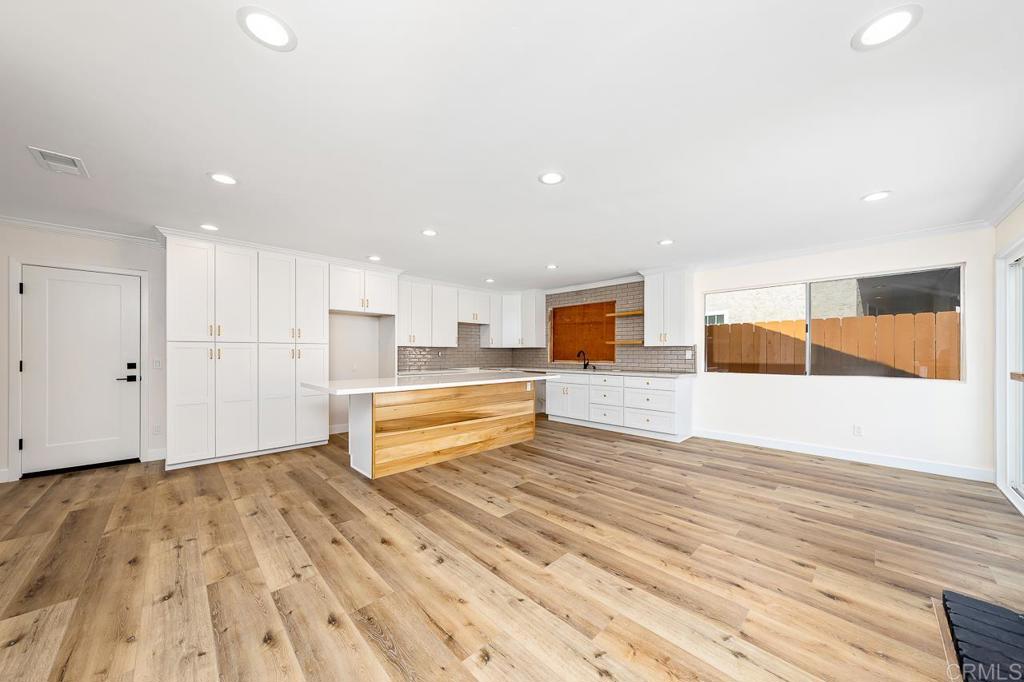 748 Cholla Road Chula Vista, CA 91910 - Photo 3 of 20 a view of a kitchen with wooden floor