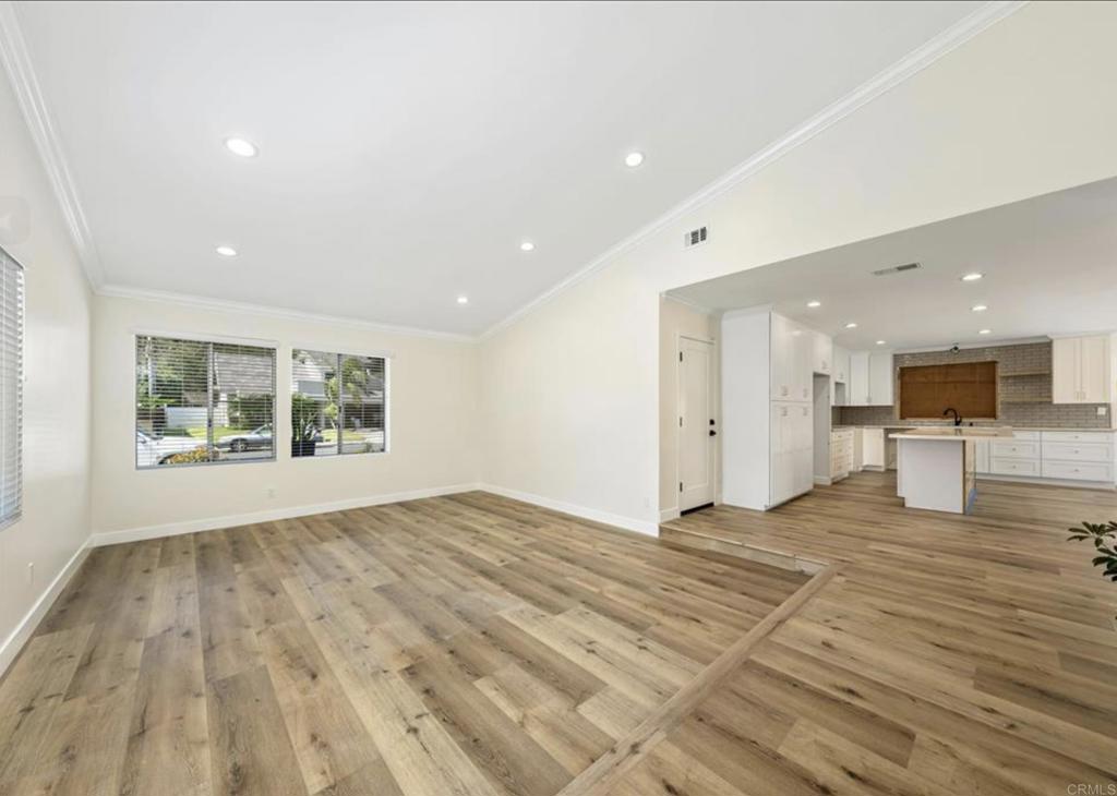 748 Cholla Road Chula Vista, CA 91910 - Photo 7 of 20 a view of an empty room with wooden floor and a window