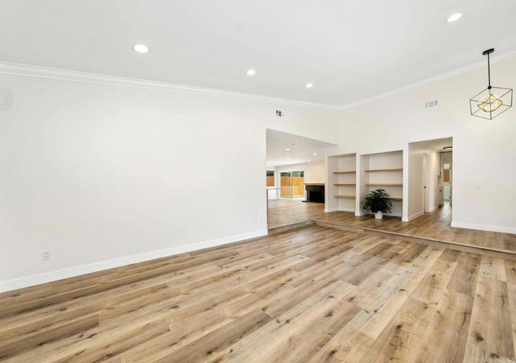 748 Cholla Road Chula Vista, CA 91910 - Photo 8 of 20 a view of empty room with wooden floor and window