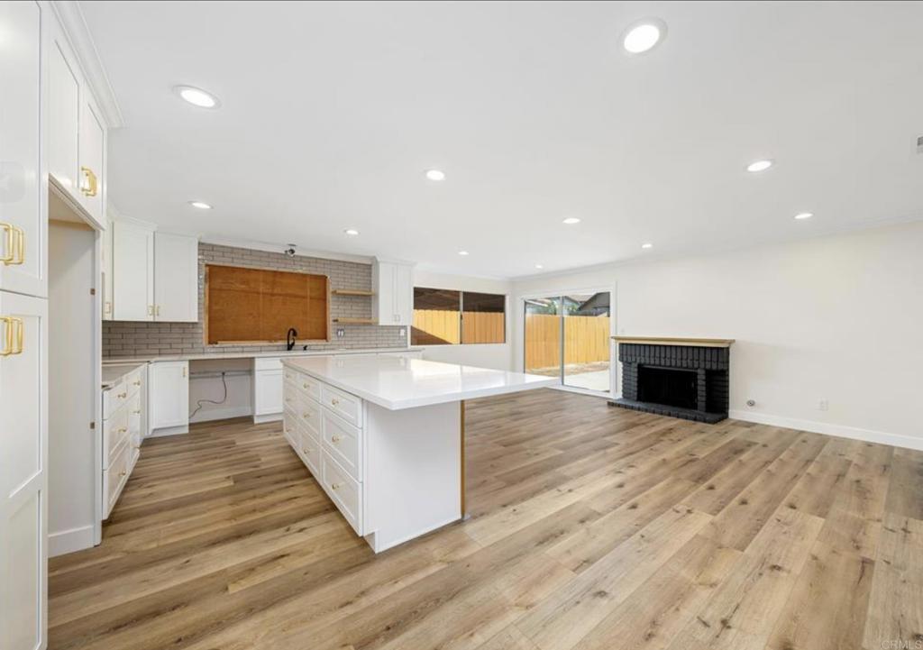 748 Cholla Road Chula Vista, CA 91910 - Photo 10 of 20 a large kitchen with a center island and stainless steel appliances