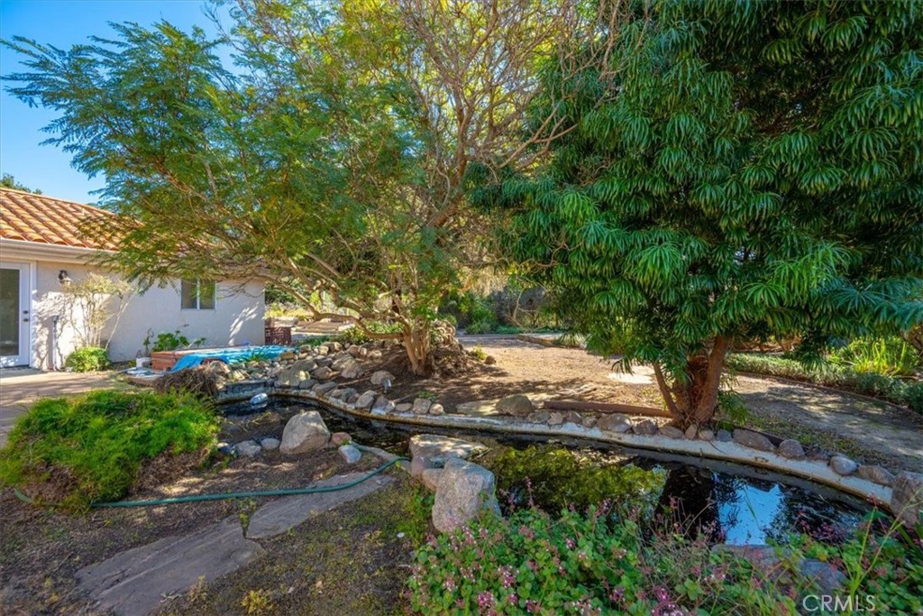 765 Ridgemont Way Arroyo Grande, CA 93420 - Photo 31 of 45 a backyard of a house with lots of green space