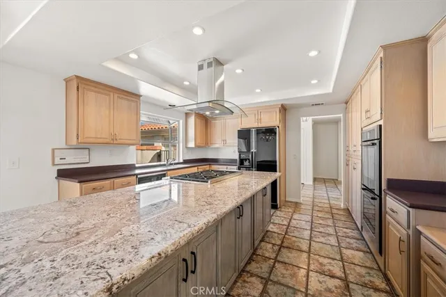 a kitchen with a stove sink and refrigerator
