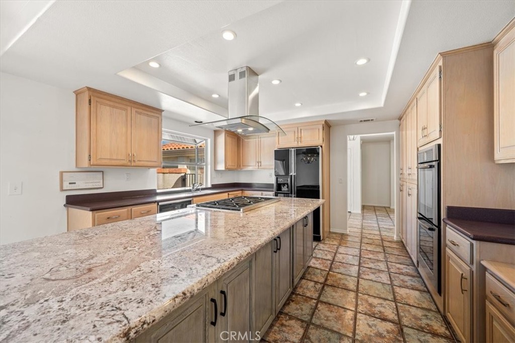 765 Ridgemont Way Arroyo Grande, CA 93420 - Photo 9 of 45 a large kitchen with kitchen island a sink stainless steel appliances and a counter top space